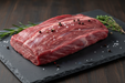 uncooked london broil roast on slate cutting board 